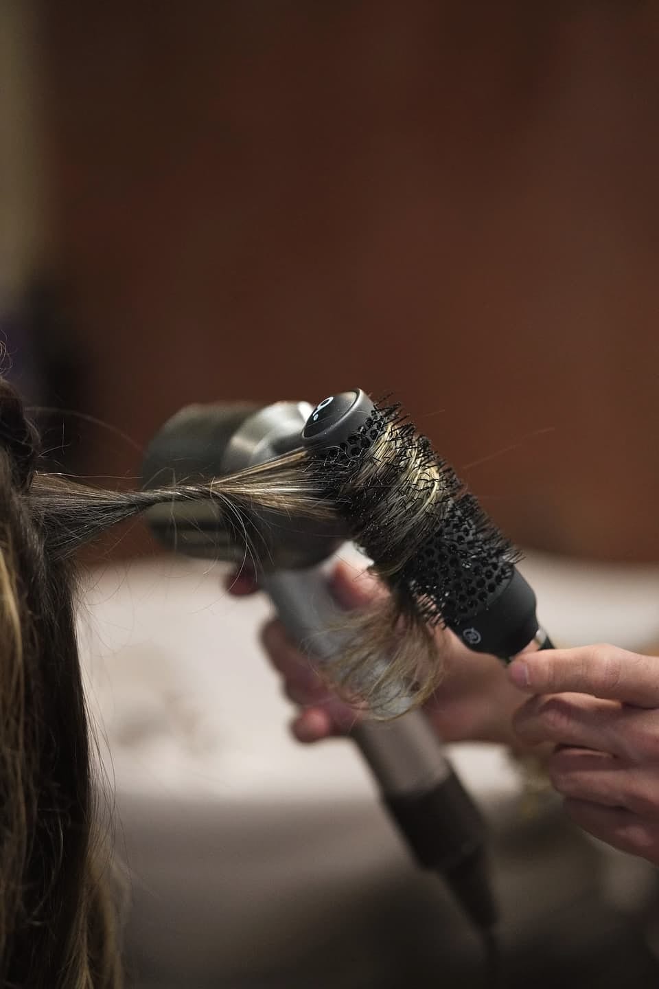 A round-brush blow-dry in motion.